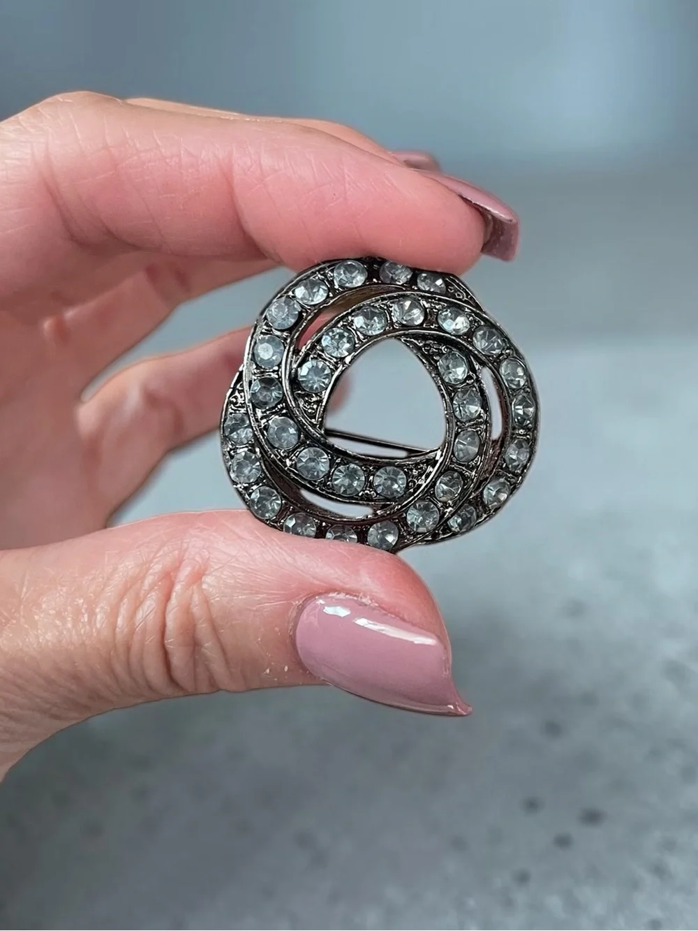 Luminous Ice Blue Crystal Gunmetal Knot Brooch Pin
